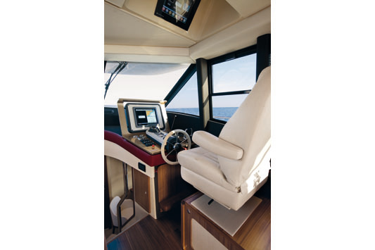 The yacht's space is extremely functional: the remote control is actually part of the salon and dining area.