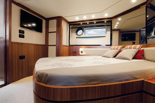 Two cabins are incredibly spacious for a yacht this size. Significant space savings in the guest cabin are achieved by placing the bed at an angle.