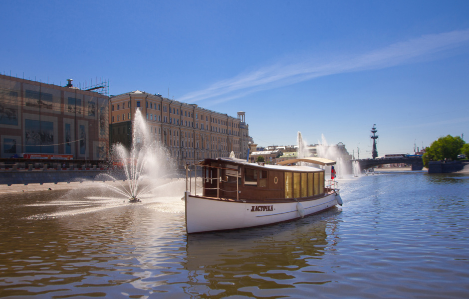 Beautiful vintage boat "Swallow" was built from scratch. It looks a bit like a London houseboat or a Dutch river boat.