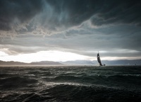 «The Bol d'Or Mirabaud regatta on Lake Geneva will be remembered for its rare power storm. When this photo was taken, the storm front was moving at a speed of over 100 km/h. It covered us, and daylight disappeared beyond the horizon. We realized that a super-modern lake catamaran can run in winds exceeding 60 knots! Ylliam's Comptoir immobilier took first place in the Décision 35 class and second in the overall standings, losing to Ladycat to Spindrift racing»,