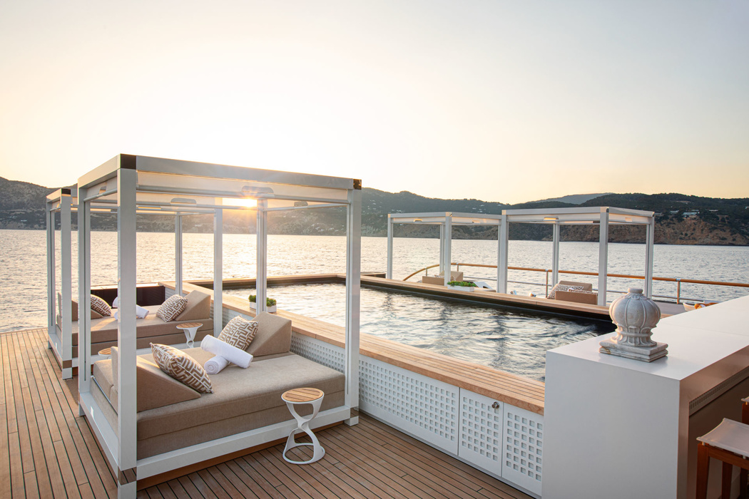 Instead of the usual sun beds by the pool - street beds cabana with awning, as in the best resorts in the world. The pool itself appears half a meter above deck level.