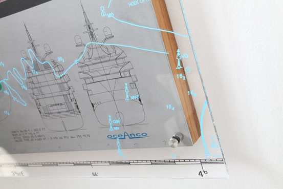 The print, applied with indelible ink on the Plexiglass, gives the composition a "third dimension" and allows the viewer to look at the drawing through the glass.