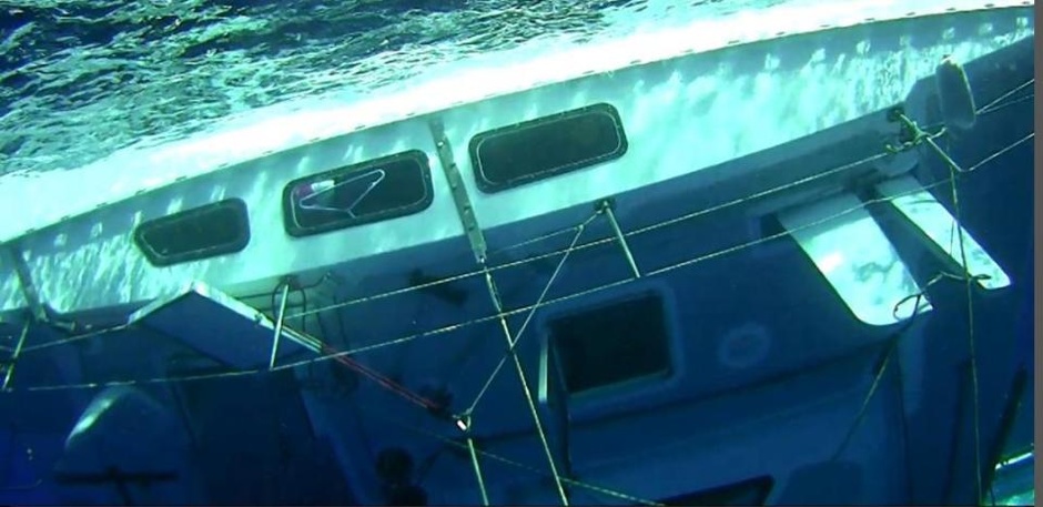 Emergency hatches on the sunken Surf into Summer catamaran were opened