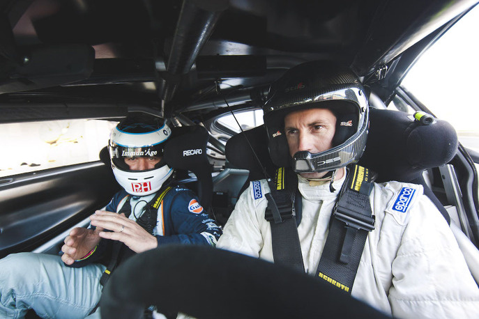 Ben Ainsley driving an Aston Martin Vantage GT4 racing car on the Silverstone circuit.