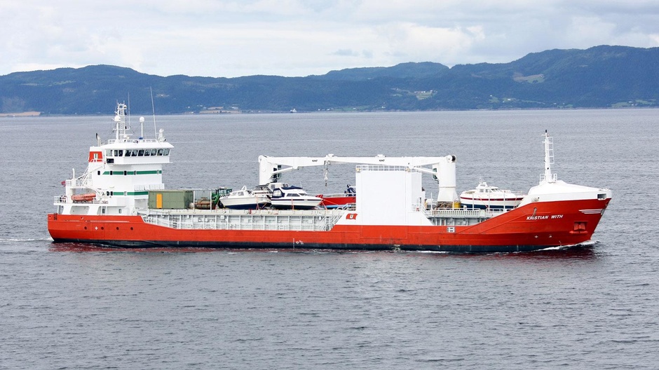 The 90 metre Kristian With dry cargo truck is used to transport small yachts. 