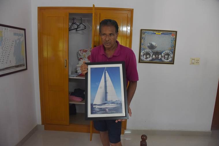 Father Abilash with the image of INSV Mhadei sailing ship.