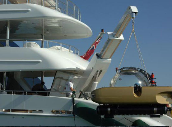 Triton boat on a crane beam