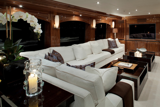 Sofas and chairs with multiple cushions create a relaxed atmosphere in the main deck saloon.