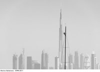 Marina Semyonova. A still from the world premiere of the new Melges 40 monotype class. Italian bowman Marco Carpinello on the top of the mast against the background of the world's tallest building, Dubai's Burj Khalifa. 