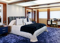 The Owner's cabin is on the upper deck and is decorated with a plush blue carpet and engraved mirrors.