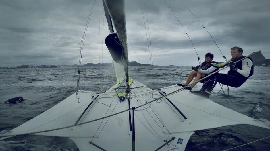 Nathan Outridge and Jan Jensen dodge a collision with the body of a dog during training in Guanabara Bay in 2014.