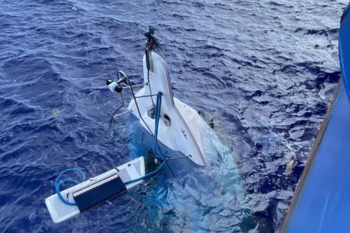 A yachtsman sat on the bow of his half-sunk yacht for more than 24 hours