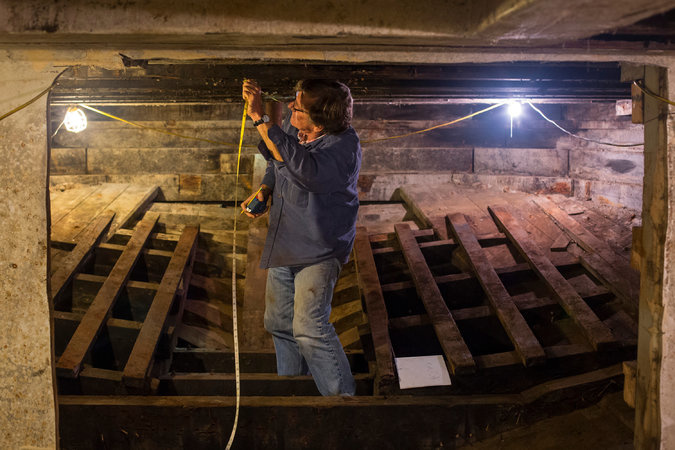 A worker inside Western Flyer in Port Townsend, Washington. The boat, built in 1937 and immortalized by John Steinbeck, will be restored as a science and education vessel.  