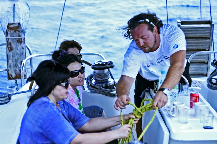Training in knitting sea knots on board a racing and cruise yacht. Photo by Ksenia Kalinina