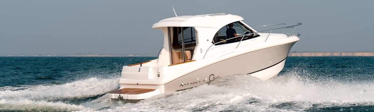 Boats that have a fully enclosed cabin or compartment for protection from the elements. 