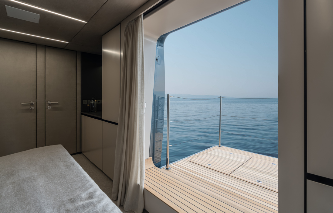 The owner's cabin features a personal retractable balcony. The master stateroom also boasts a large walk-in closet and a TV extending from the ceiling.