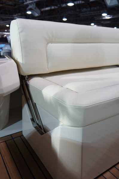 Sofa with flip back on the flybridge. You can join the skipper, or you can join other guests at the table.