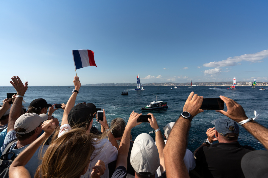 Fans welcome the French team to the finish line