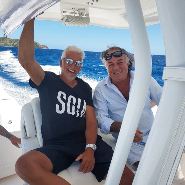 Dan Lenard and a yachtsman from Antigua and Barbuda Carlo Falcone at a short stop off the coast of Antigua.