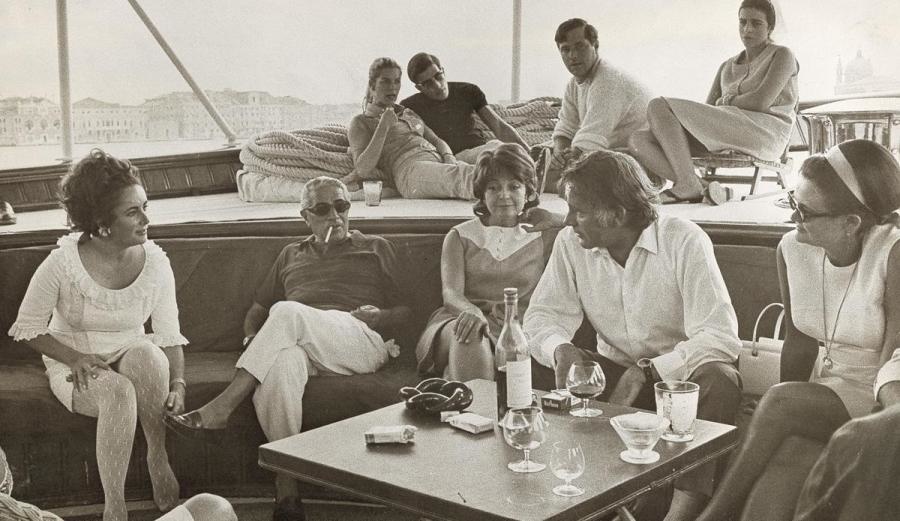 Aristotle Onassis on a famous yacht with Elizabeth Taylor and Richard Burton.