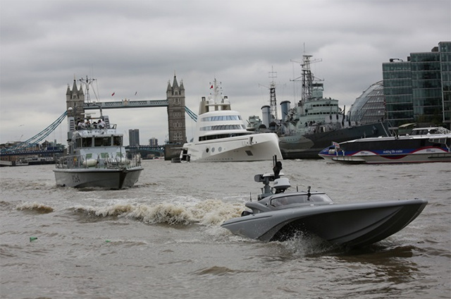 MAST during tests on the Thames against the background of» Andrey Melnichenko's megayacht«.