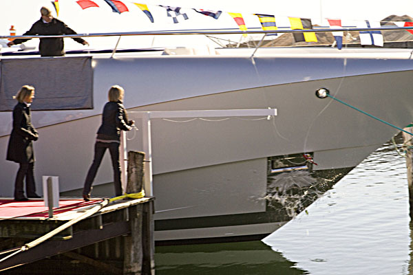 Traditional "baptism" with a bottle of champagne on board. Appreciate the moment you've caught it.