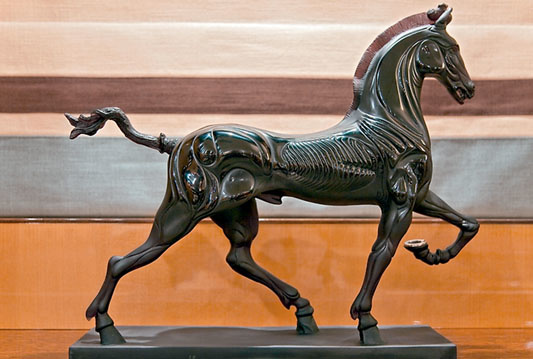 A statue of an Art Deco cloaked horse adorns the owner's office.