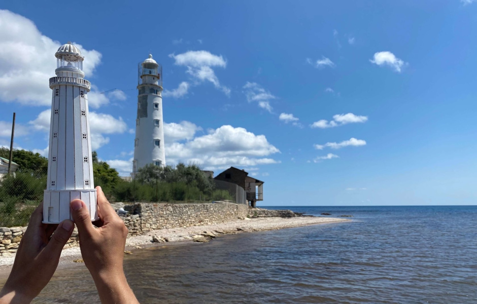 The real Tarkhankutskiy lighthouse in the Crimea and its model