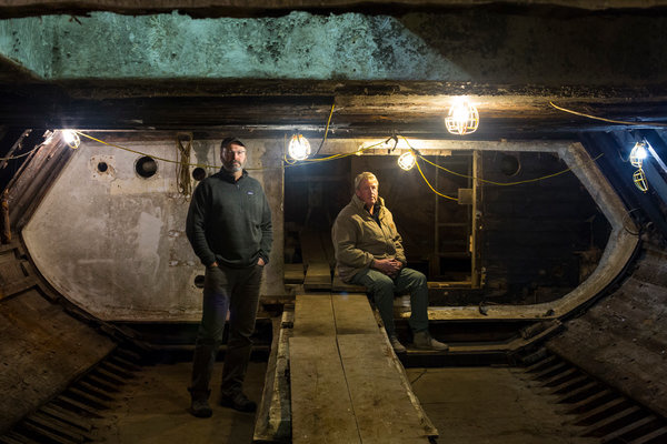 Chris Chase (left) leads the Western Flyer restoration work. Owner John Gregg (right) knows he overpaid for a boat that may have "cost nothing at all".