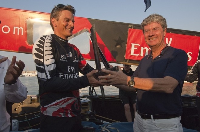 Yves Carcel presents the Louis Vuitton Trophy to a team from New Zealand.