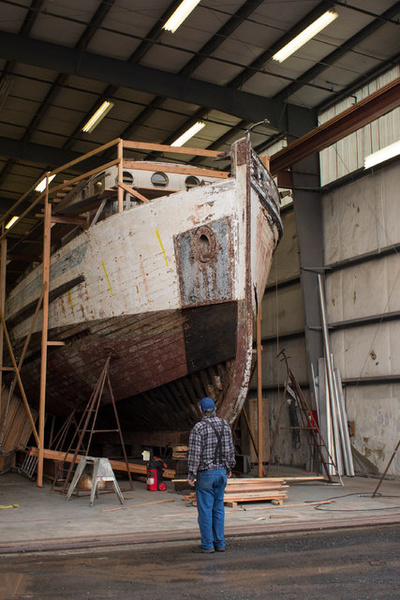 The deteriorating Perroquet II wooden fishing boat in Tour…