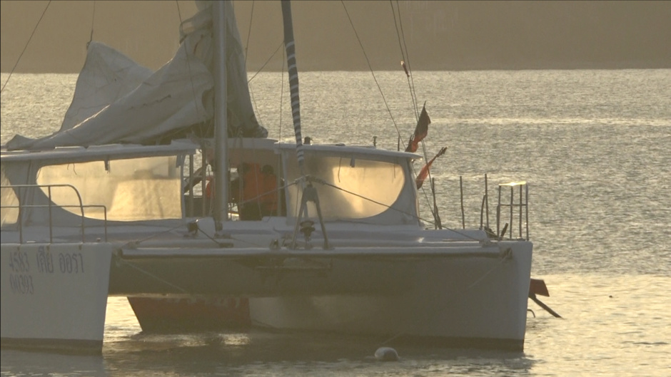 Police arrest a Russian aboard a catamaran.